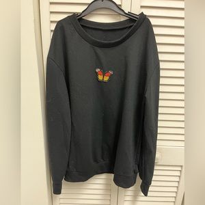 Size medium Black sweater white butterfly on it